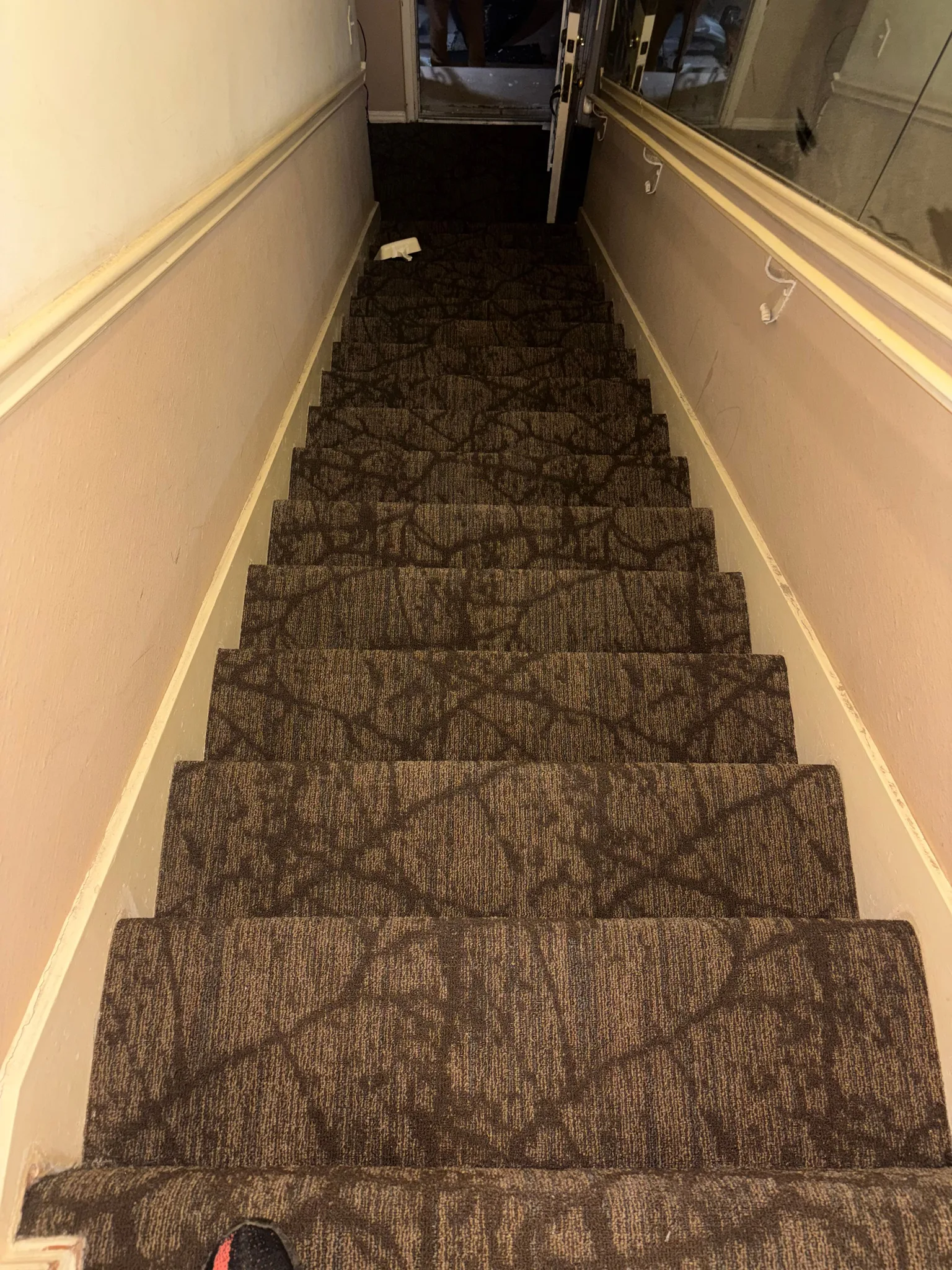 Patterned carpet on a narrow stair