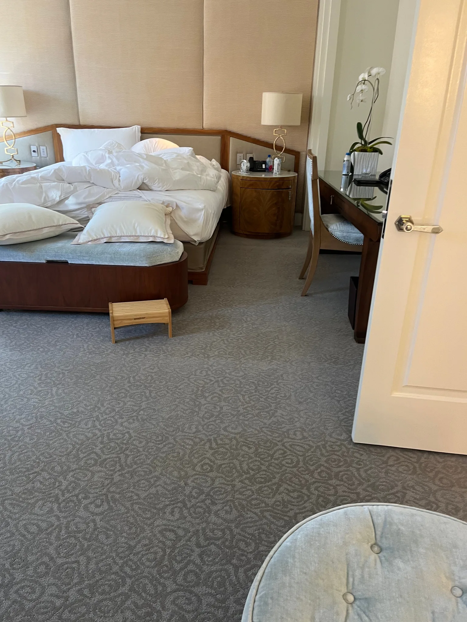 Patterned carpet in a hotel bedroom