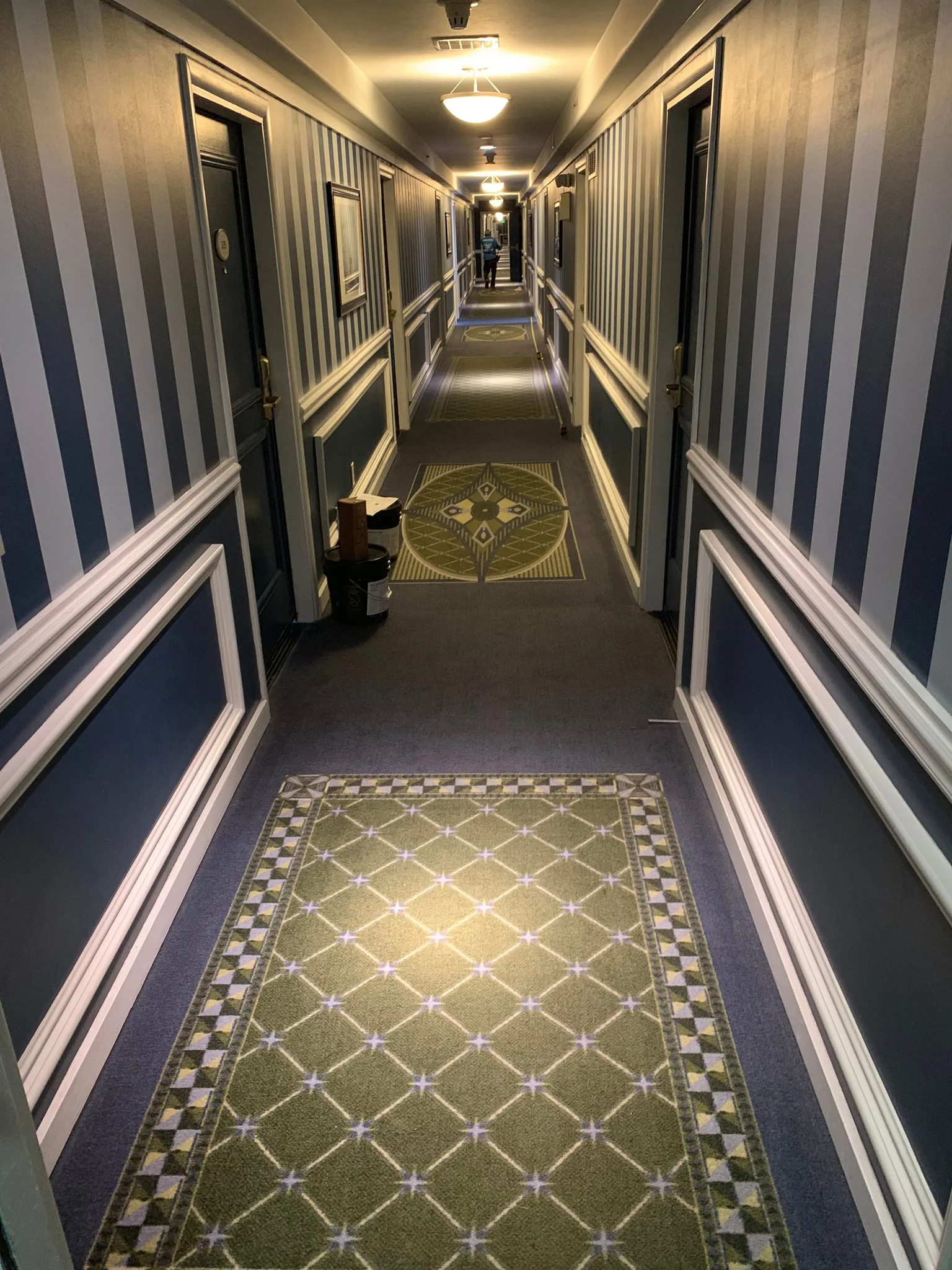Lattice-pattern corridor carpet with a border and medallion inset in Redondo Beach