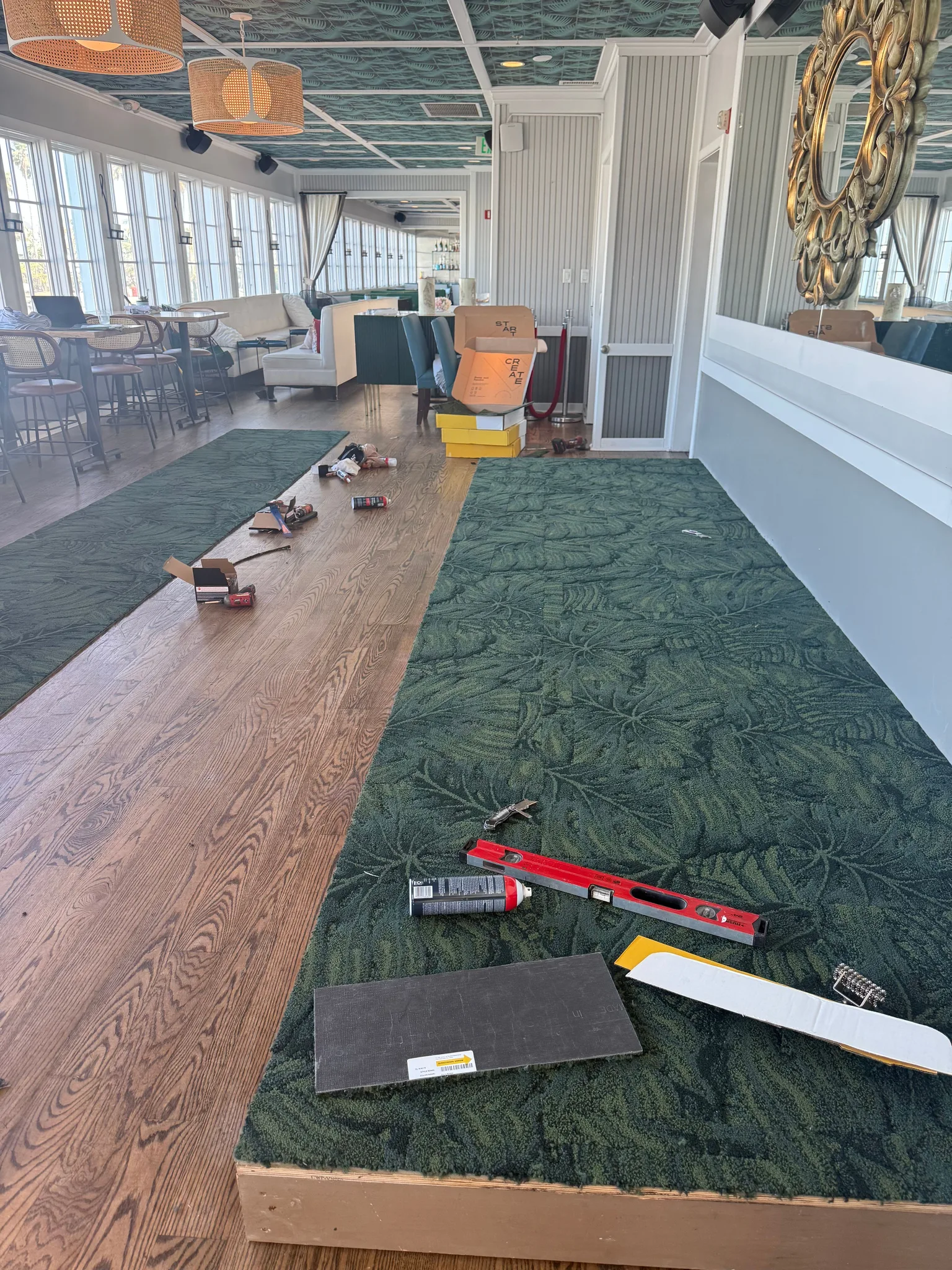 Green patterned carpet on a raised platform