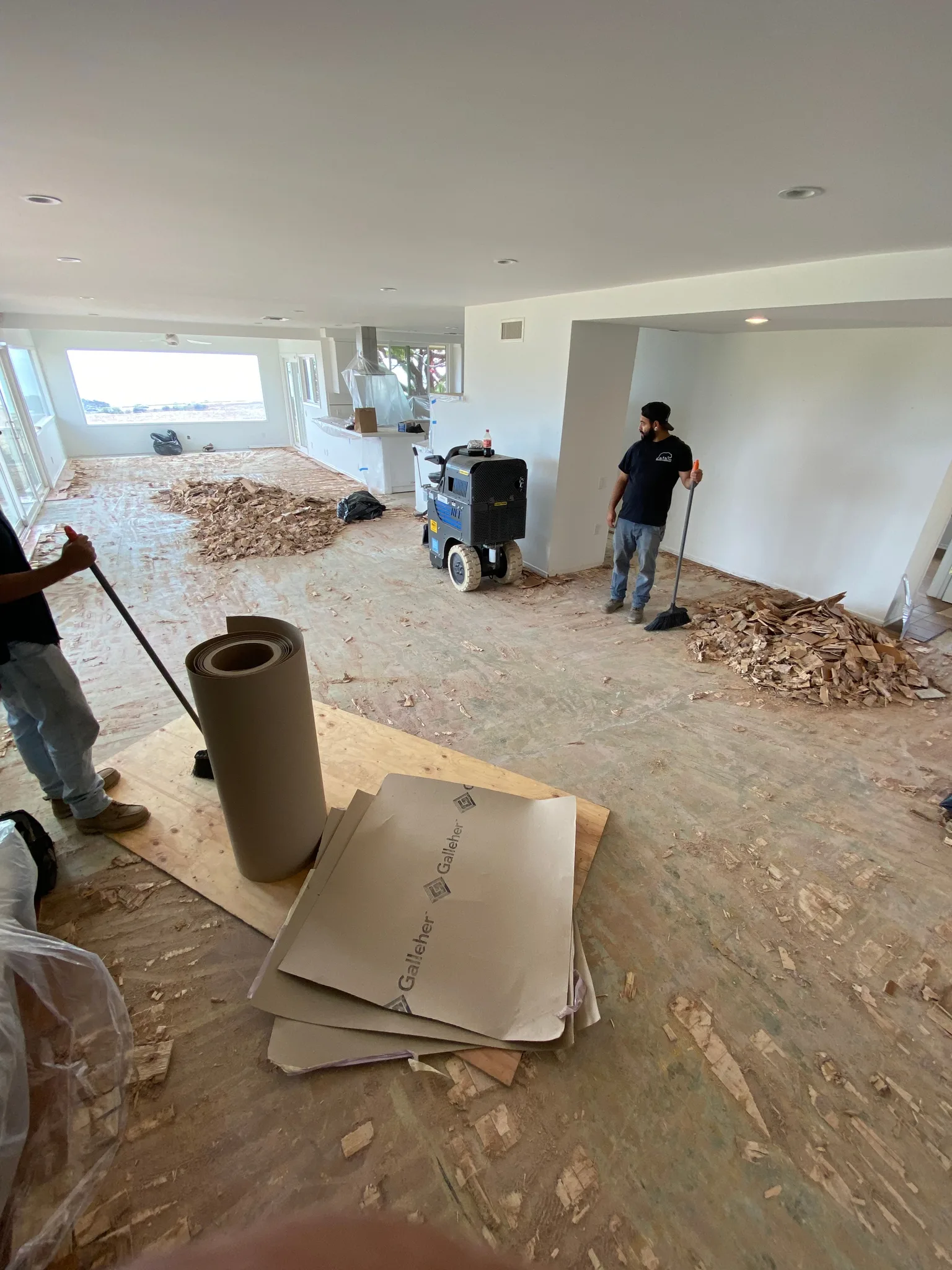 Crew sweeping up after a tear-out