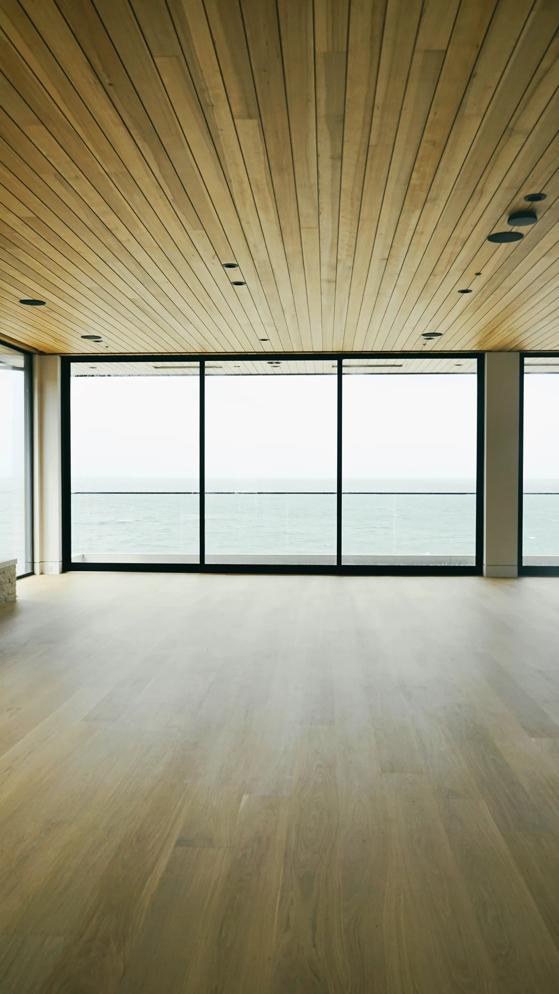 Wide-plank white oak toward the ocean under a cedar ceiling in Redondo Beach