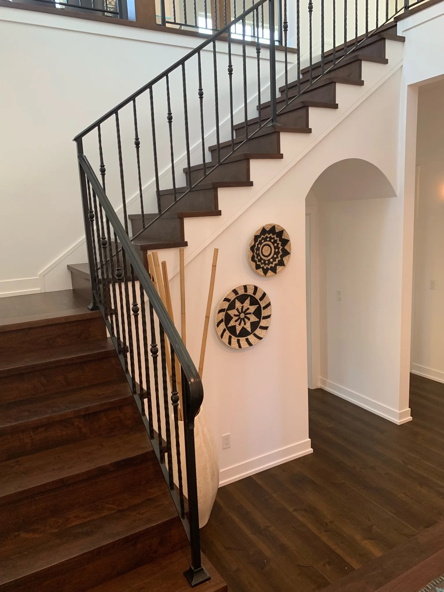 Custom-stained maple steps with iron balusters, matched to the floor in Redondo Beach