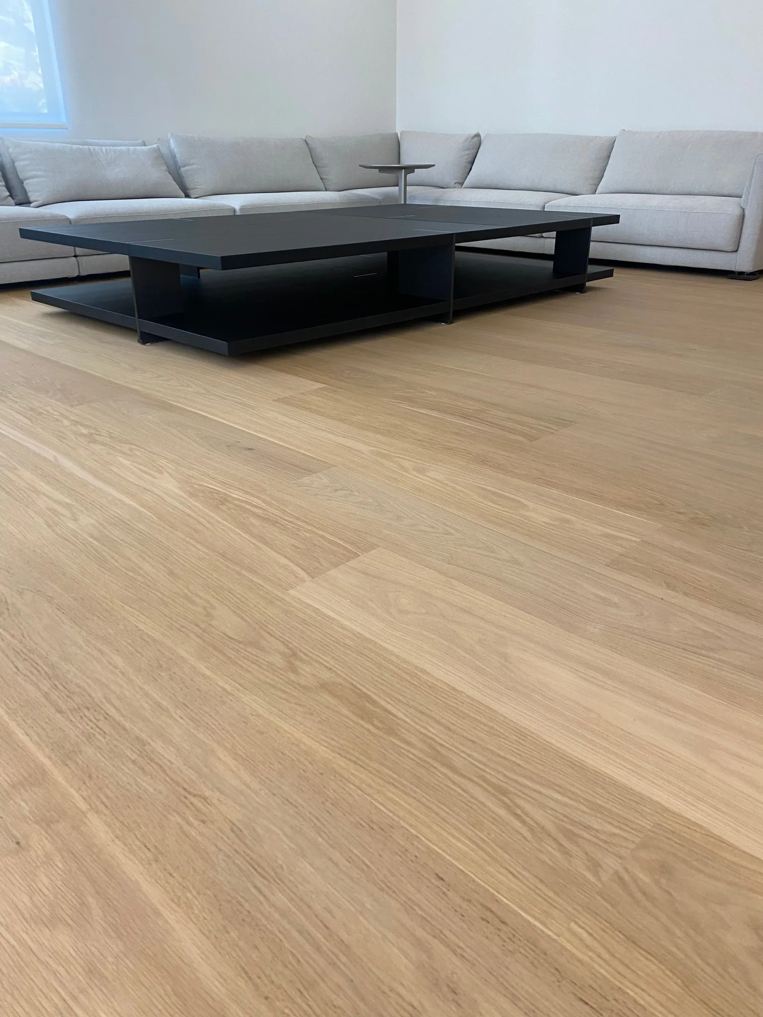 Pale wide-plank white oak in a natural matte finish