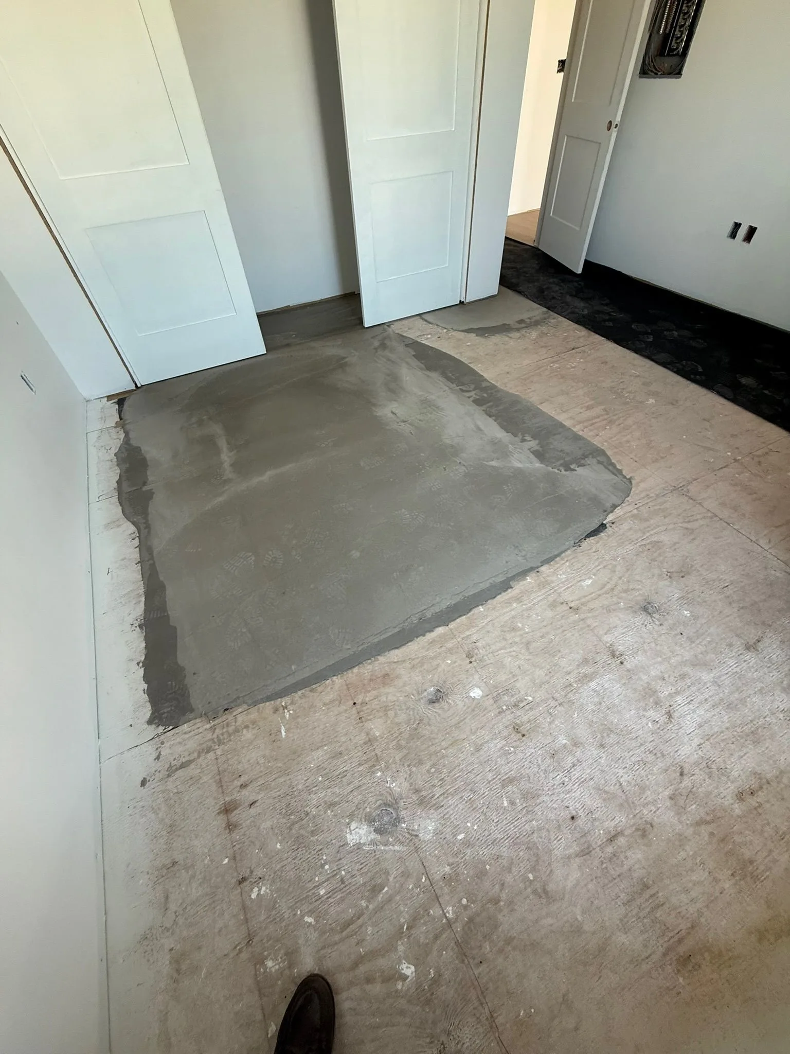 Leveling patch feathered out in front of a closet