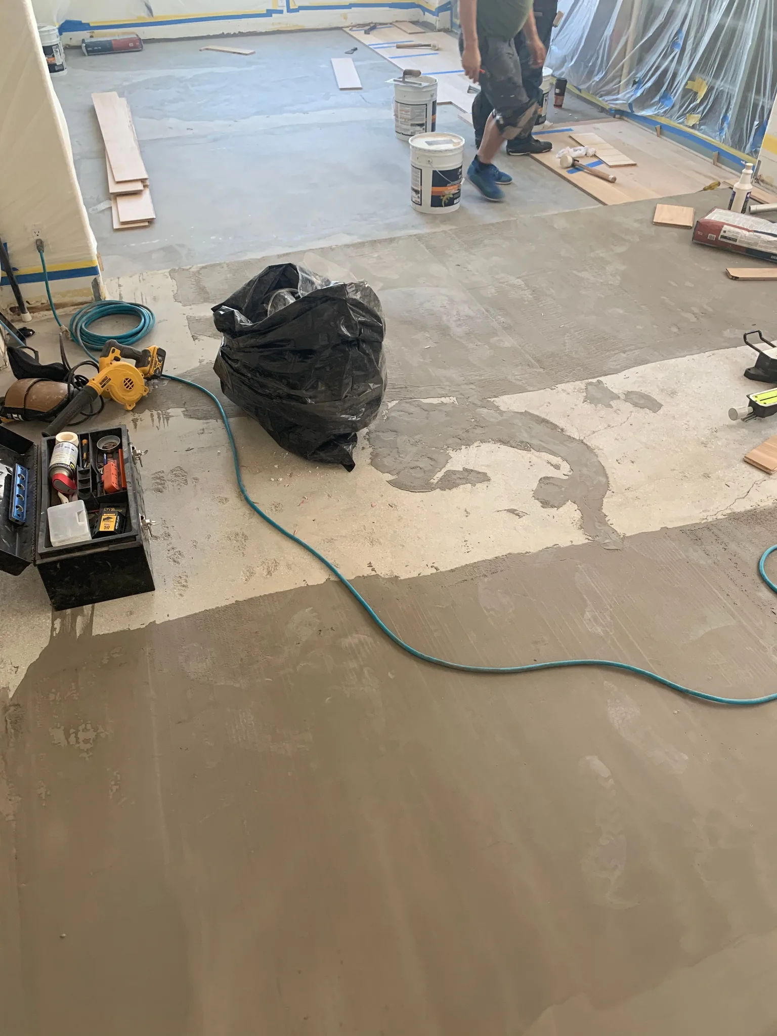 Cured leveling patches across a slab