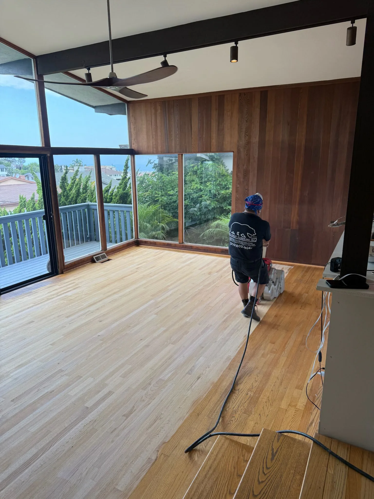 Oak strip sanded bare beside its old amber finish