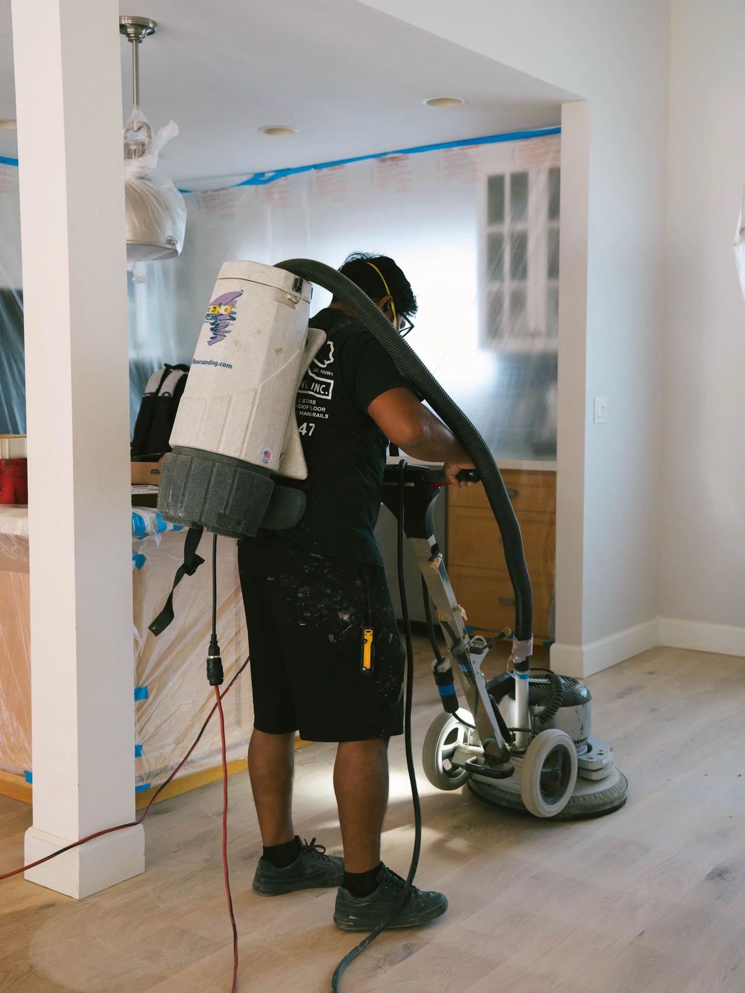 Buffing wood floors with a back pack vac
