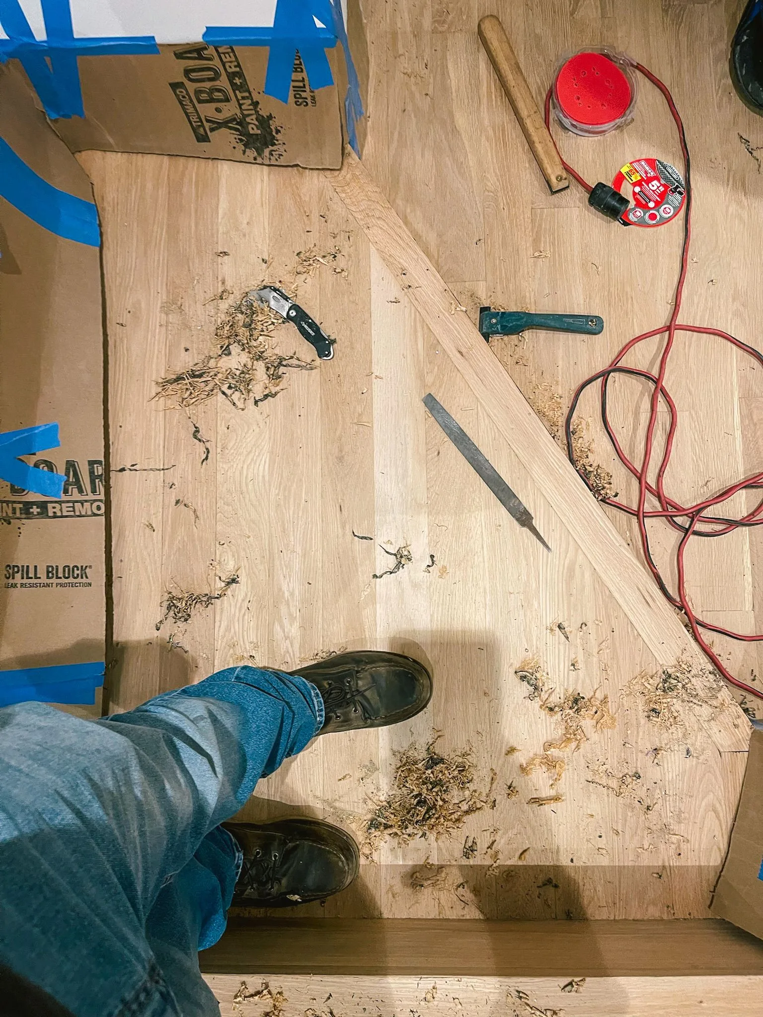 Raw oak hand scraped where machines can't reach