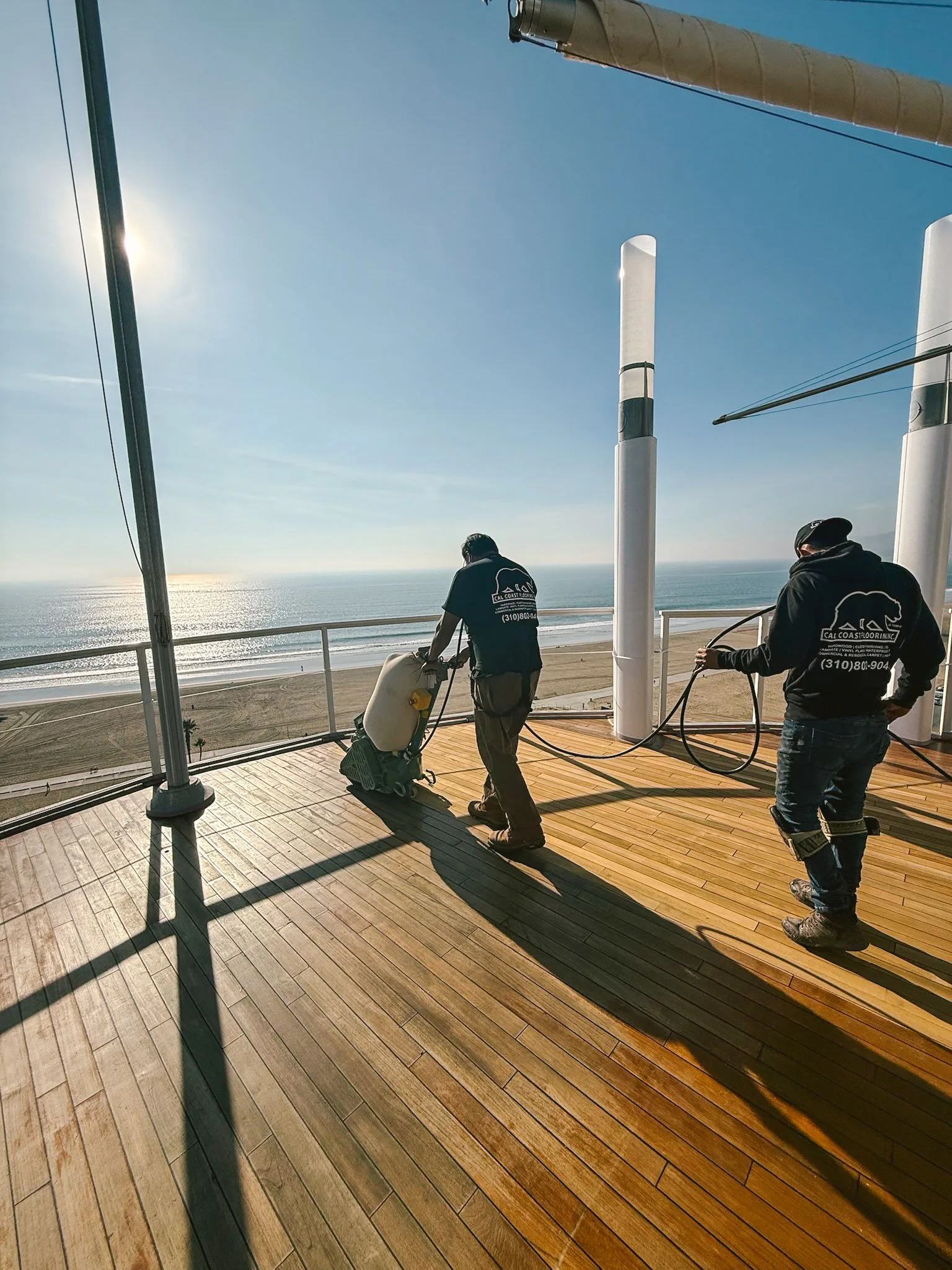Sanding a wood deck with a view