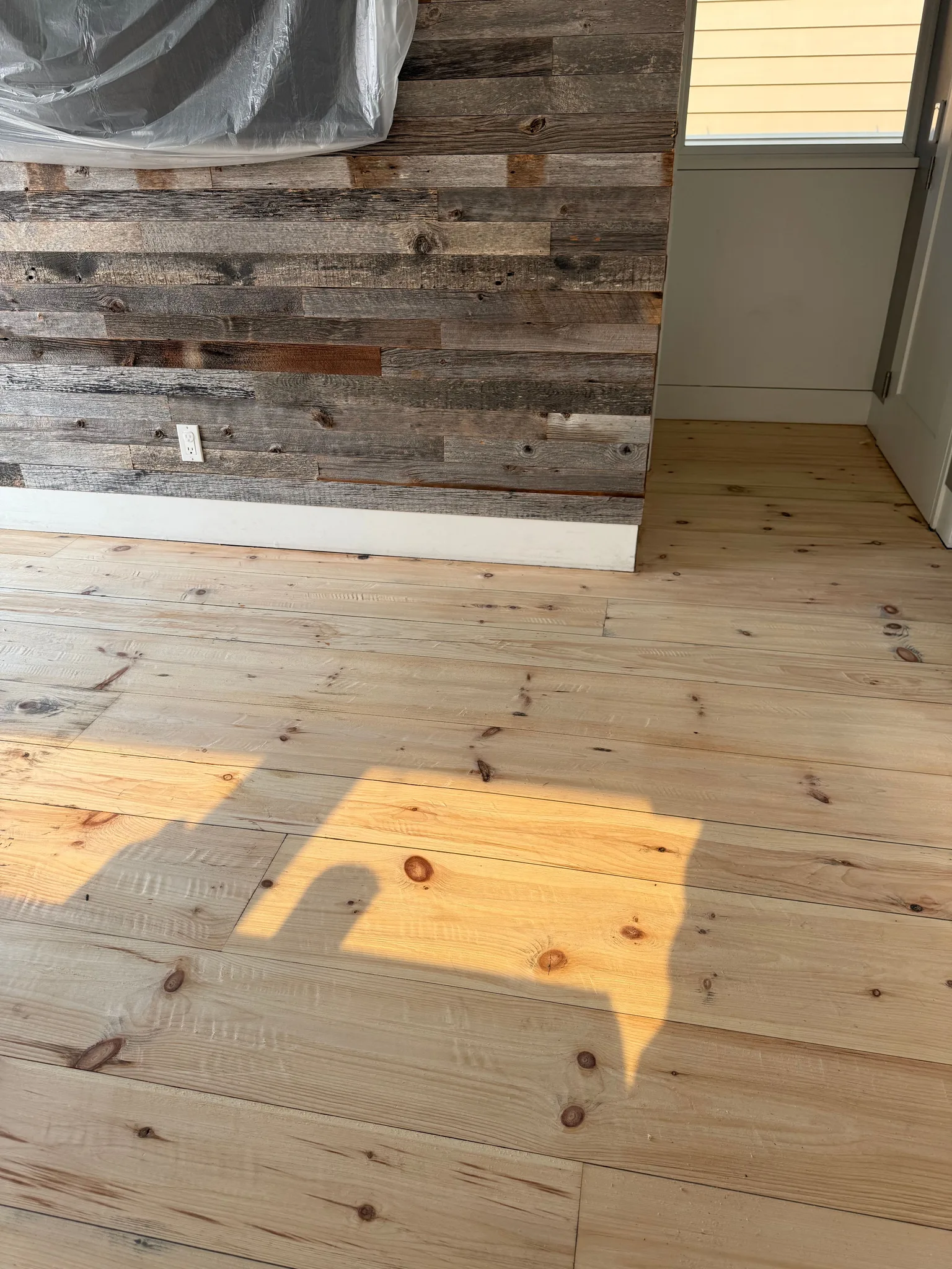 Knotty yellow pine sanded raw with hand scraping added