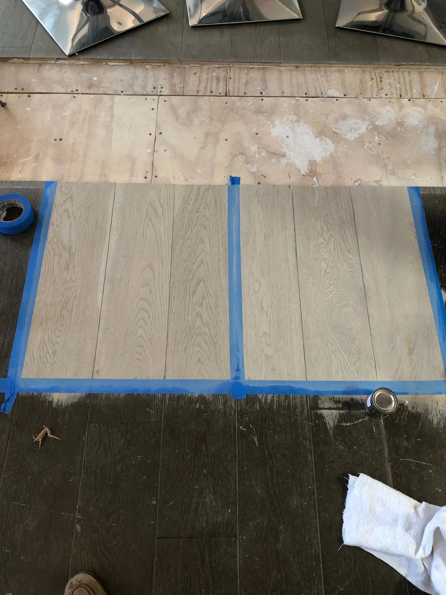 Before and after in one frame: dark floor, pale samples