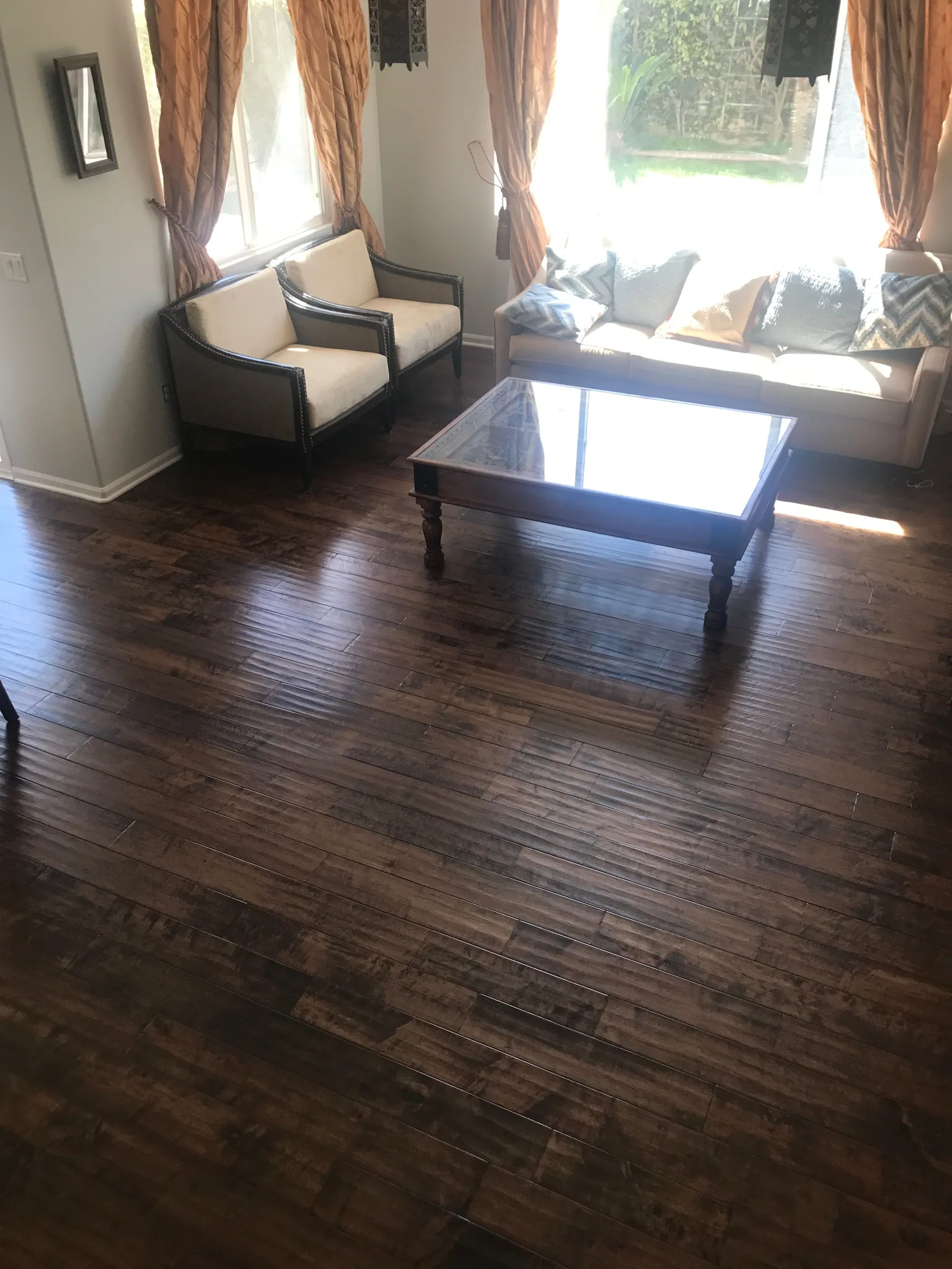 Hand scraped hardwood in a dark stain, low sheen