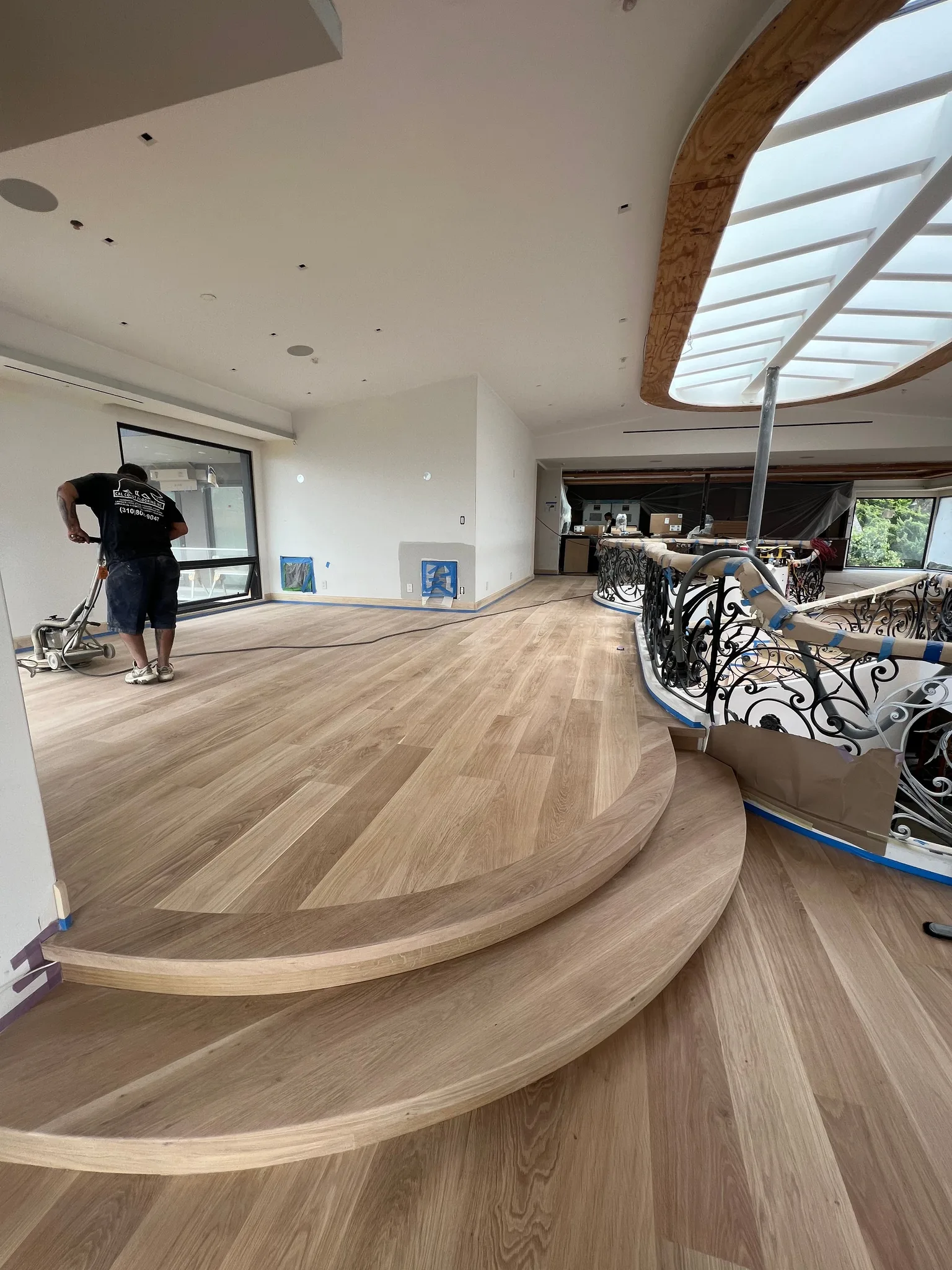 Curved oak steps and floor sanded bare