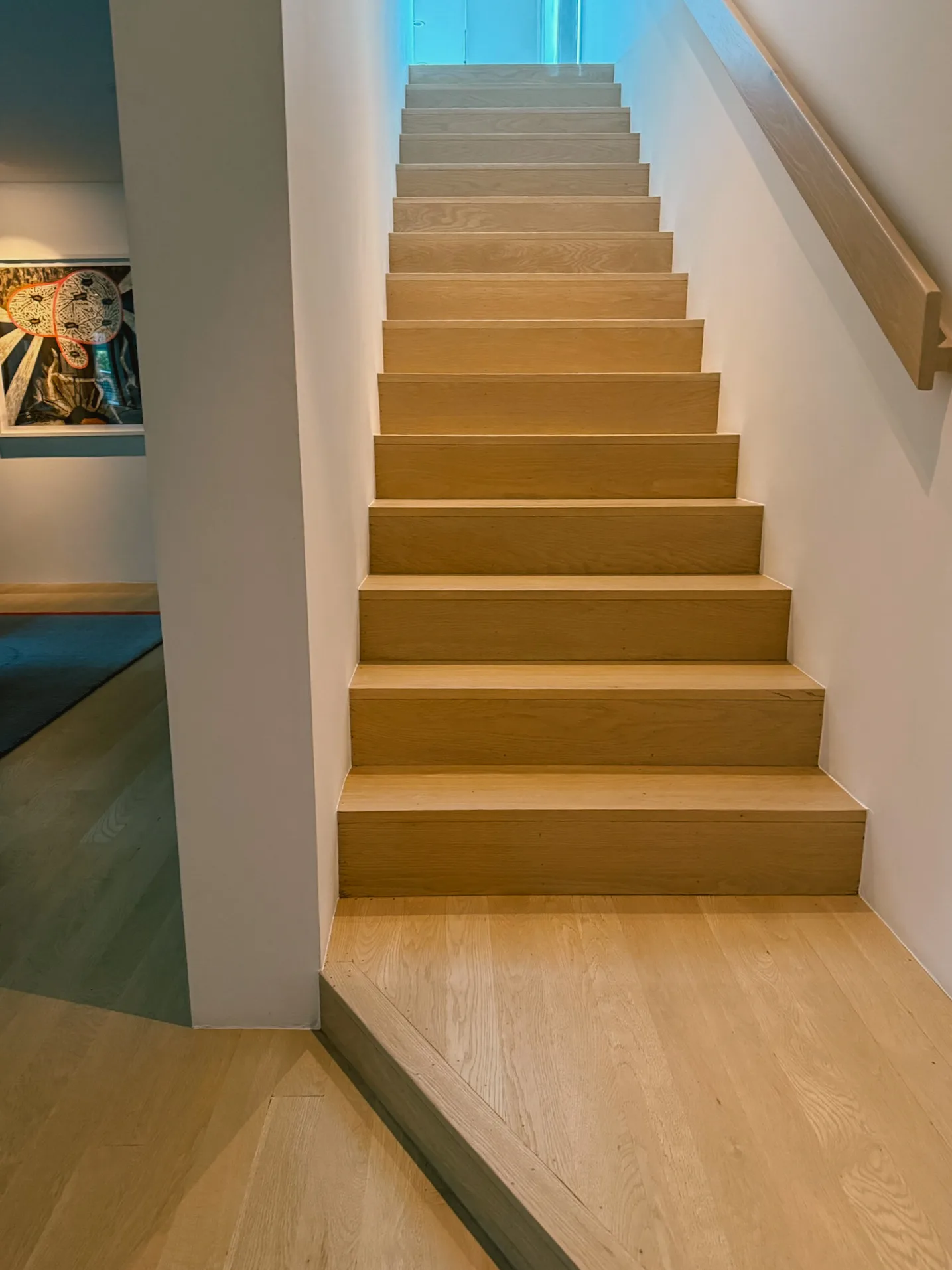 Oak tread and riser mitered together for a waterfall profile