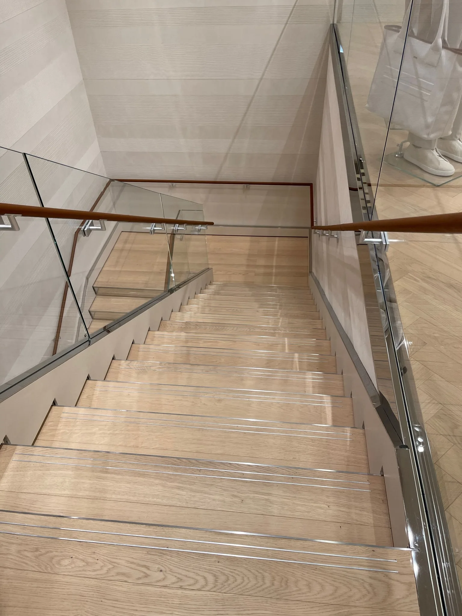 Natural oak stairs with metal inlay nosing strips in Beverly Hills