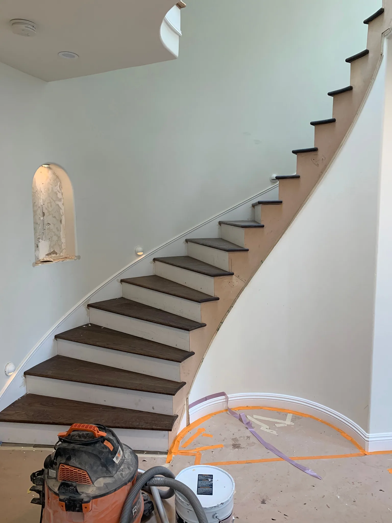 Spiral staircase with paintgrade riser miter to skirt in Hermosa Beach