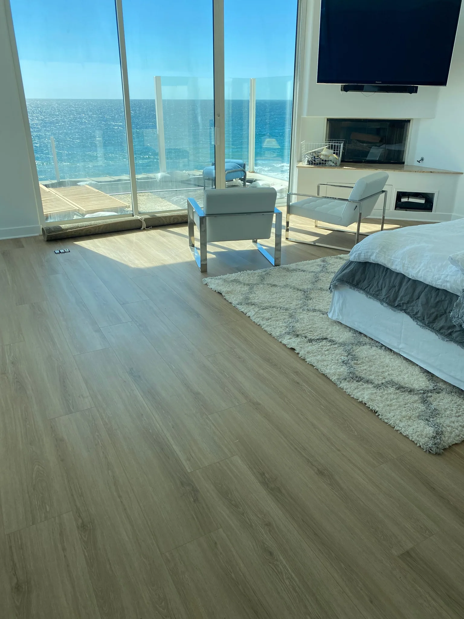 Wood-look vinyl plank in an ocean-view bedroom