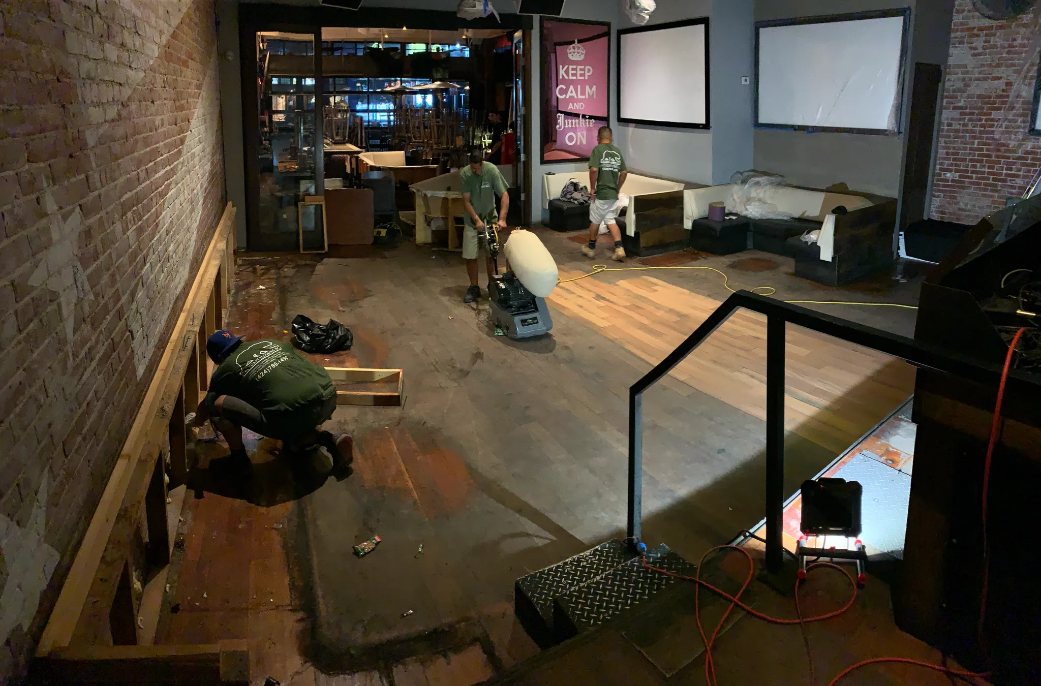 Work in progress: Cal Coast Flooring crew sanding the original wood floor at the American Junkie gastropub