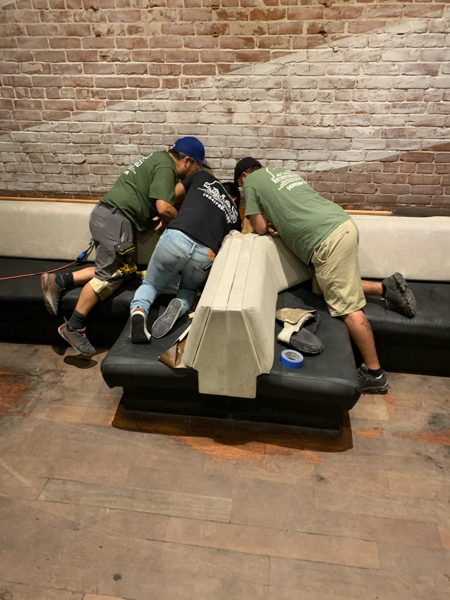 Work in progress: Cal Coast Flooring crew resetting booth seating during the American Junkie floor project