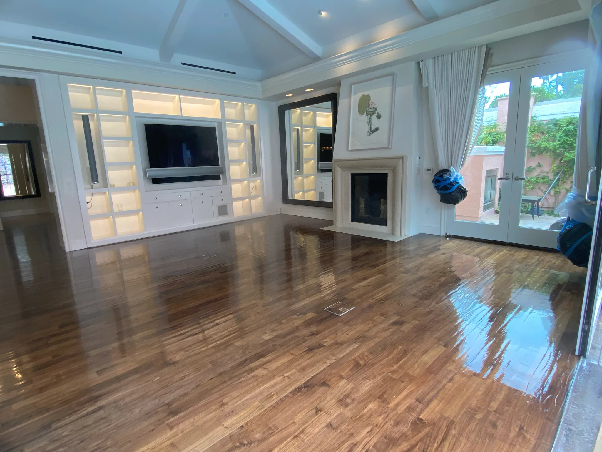 Custom walnut flooring installed and finished by Cal Coast Flooring in a fireplace lounge at The Beverly Hills Hotel