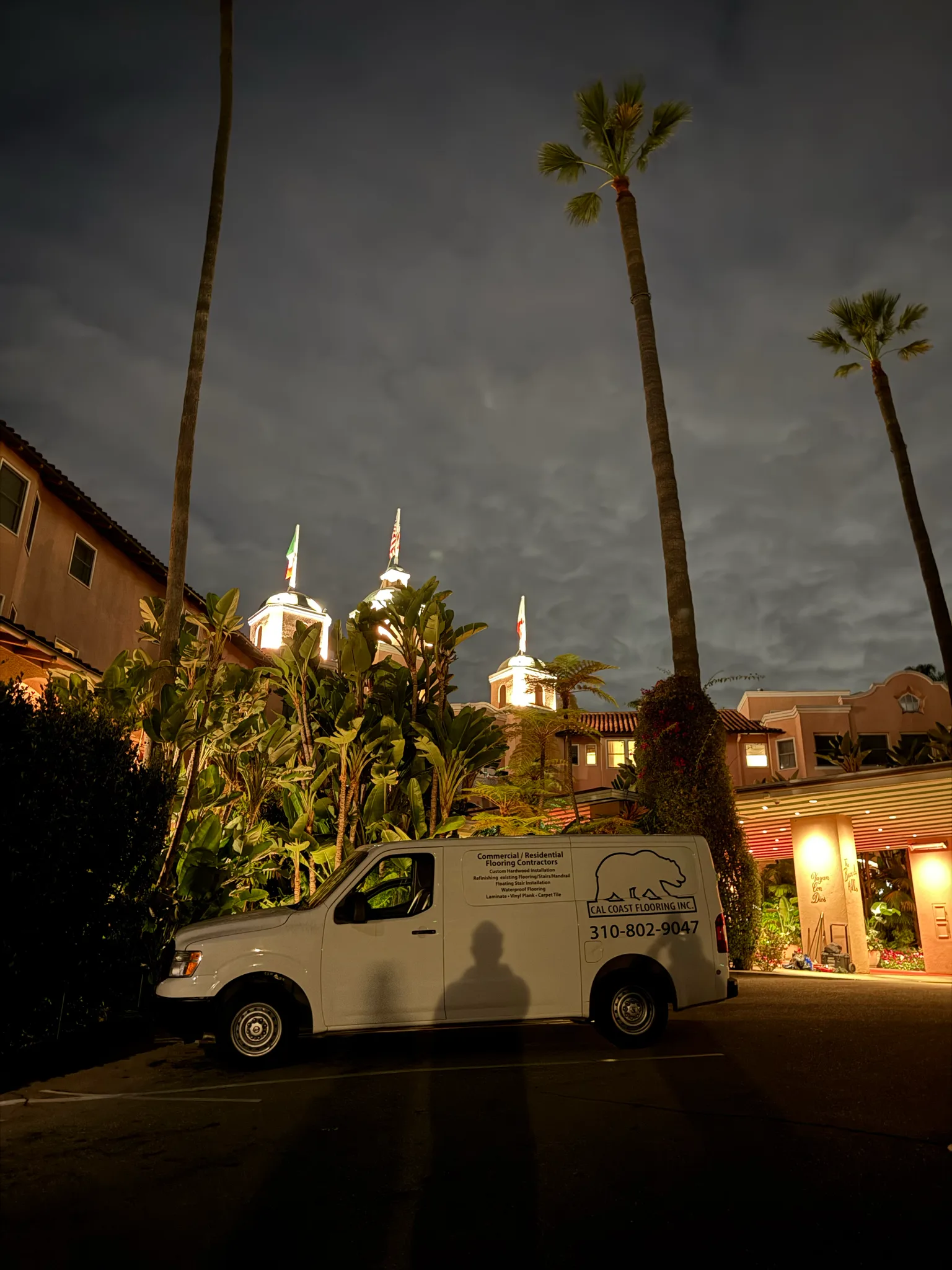 Cal Coast Flooring van parked beneath the towers of The Beverly Hills Hotel at night