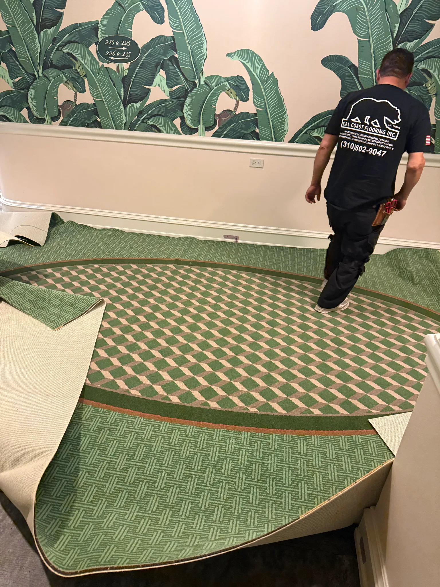 Work in progress: circular medallion carpet being fitted in an elevator landing at The Beverly Hills Hotel