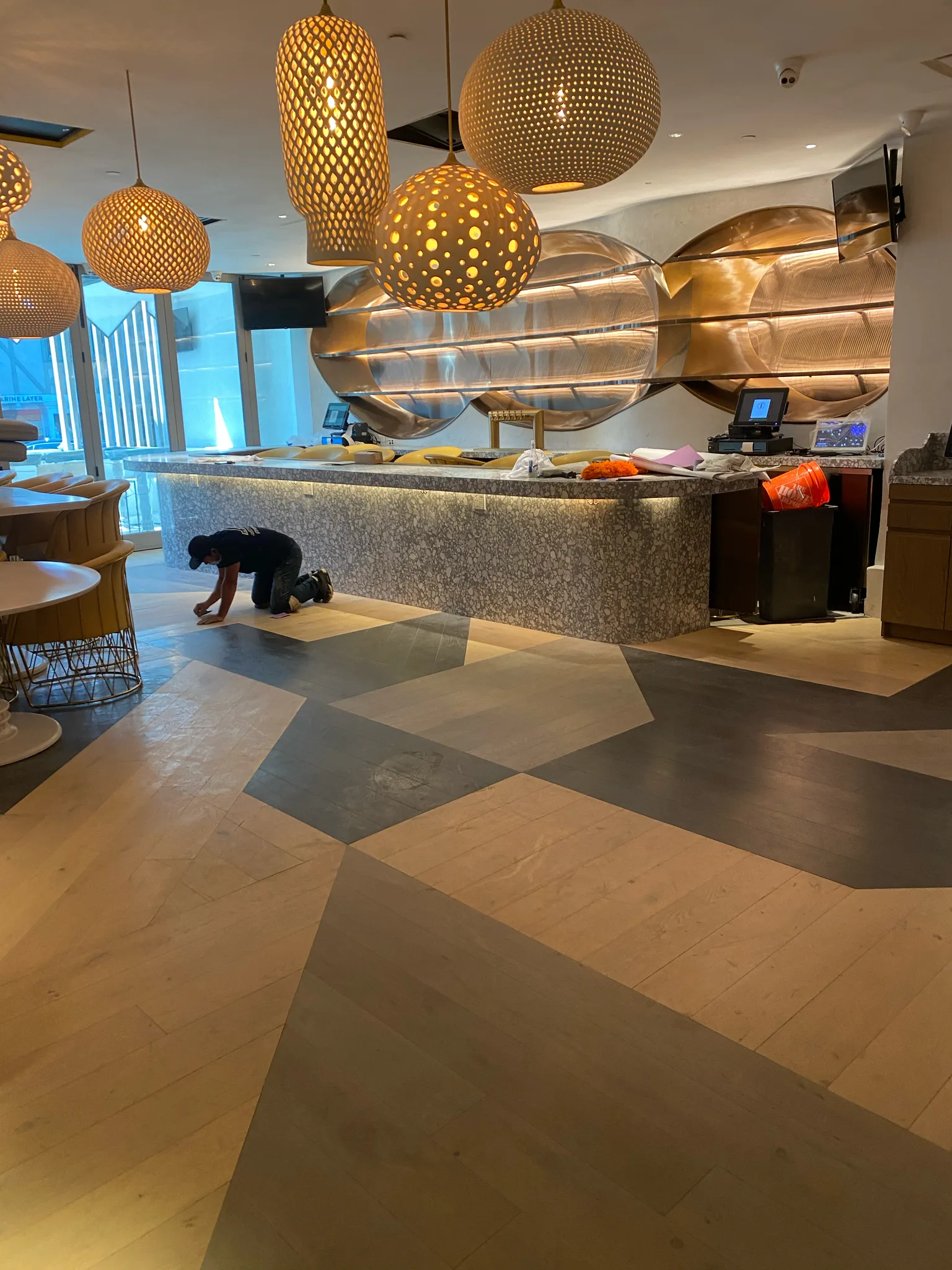 Multi-tone wood plank floor installed by Cal Coast Flooring across the Esperanza dining room in Manhattan Beach