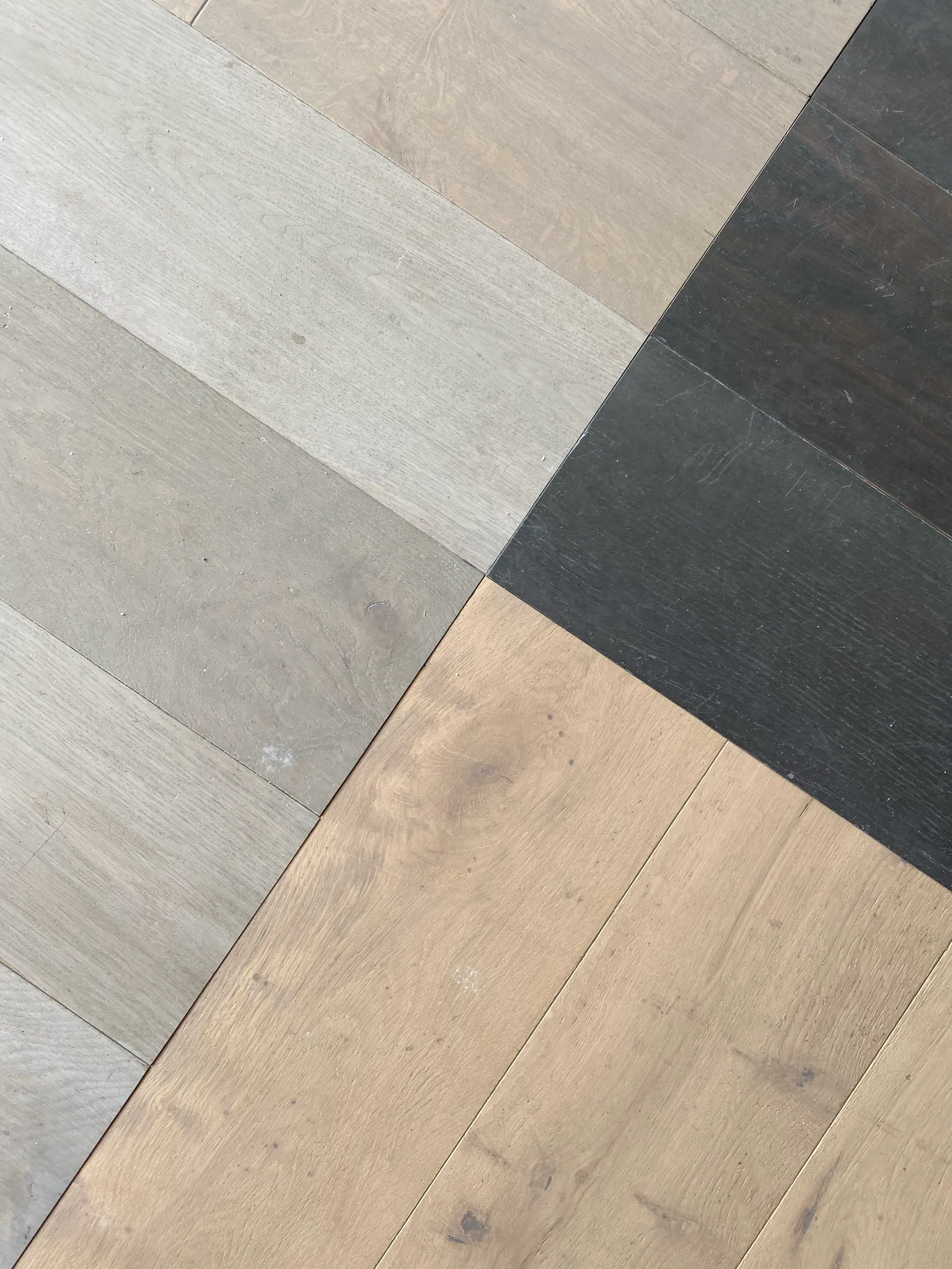 Detail of the multi-tone geometric plank floor Cal Coast Flooring installed at Esperanza