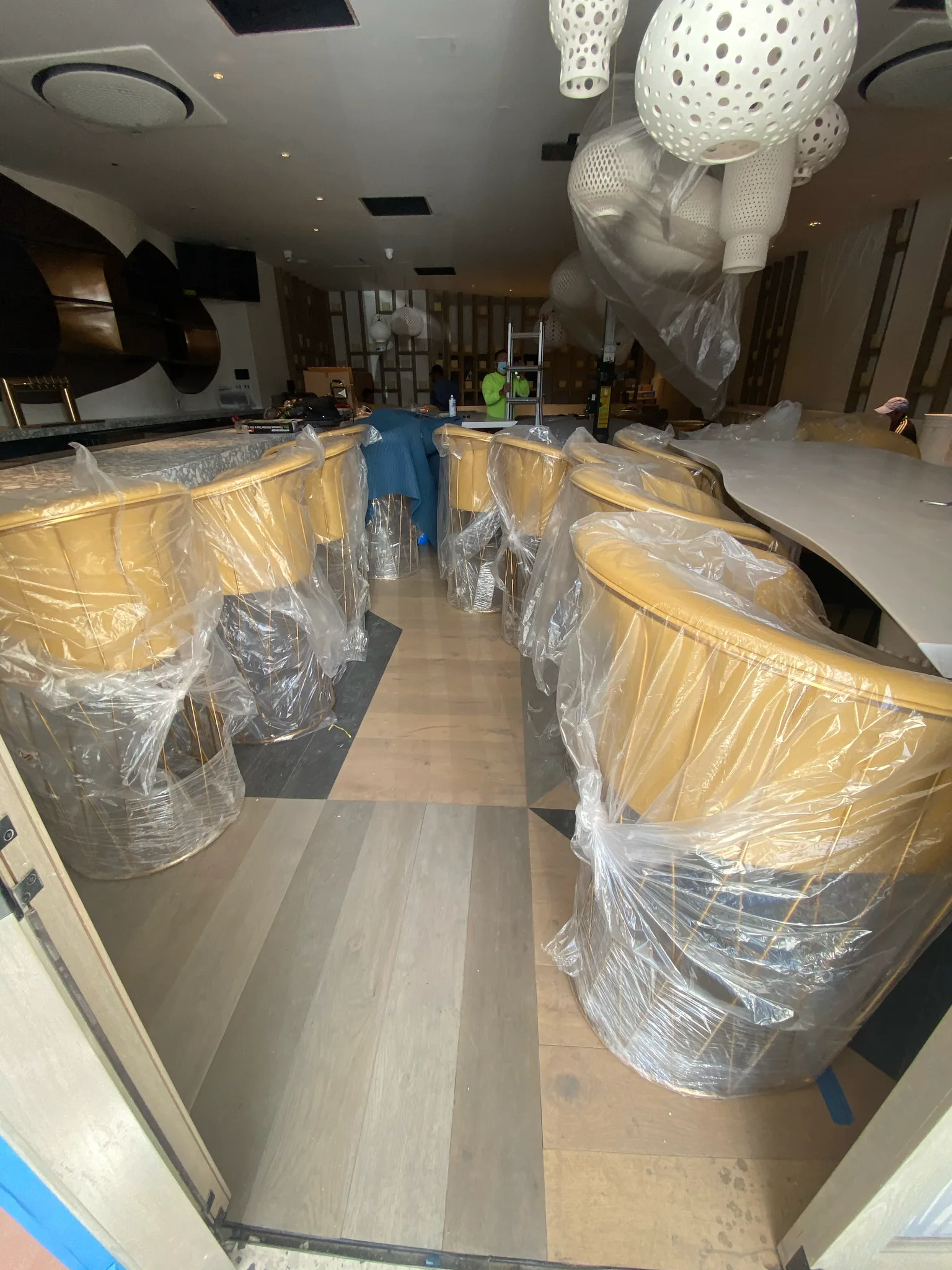 Work in progress: new plank flooring beneath wrapped seating in the Esperanza dining room — Cal Coast Flooring