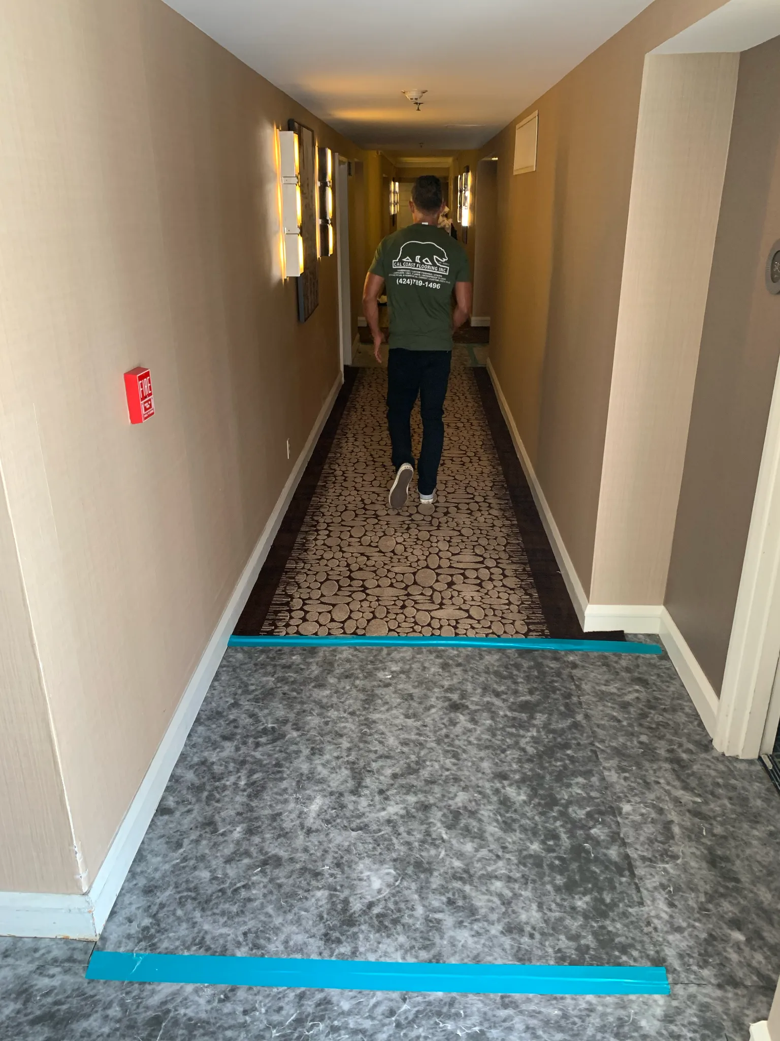Work in progress: Cal Coast Flooring crew member on new corridor carpet at Omni Los Angeles