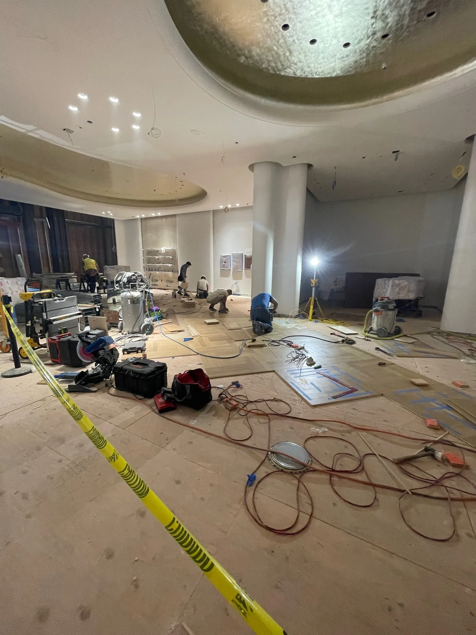 Cal Coast Flooring crew laying the oak parquet field at the Tiffany & Co. Glendale store