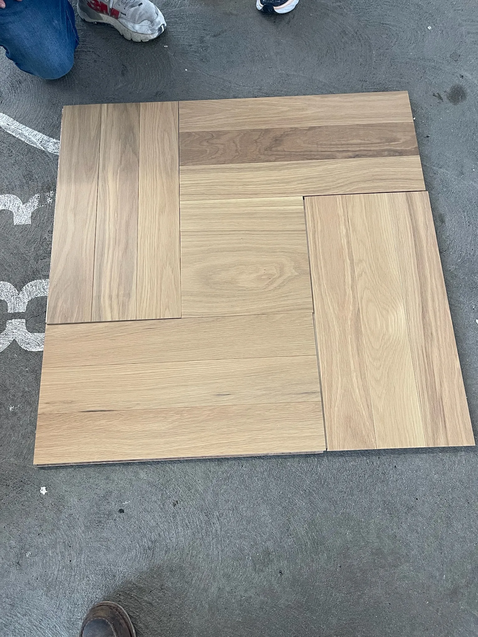 Basket-weave oak pattern mockup laid out before installation at Tiffany & Co. Glendale