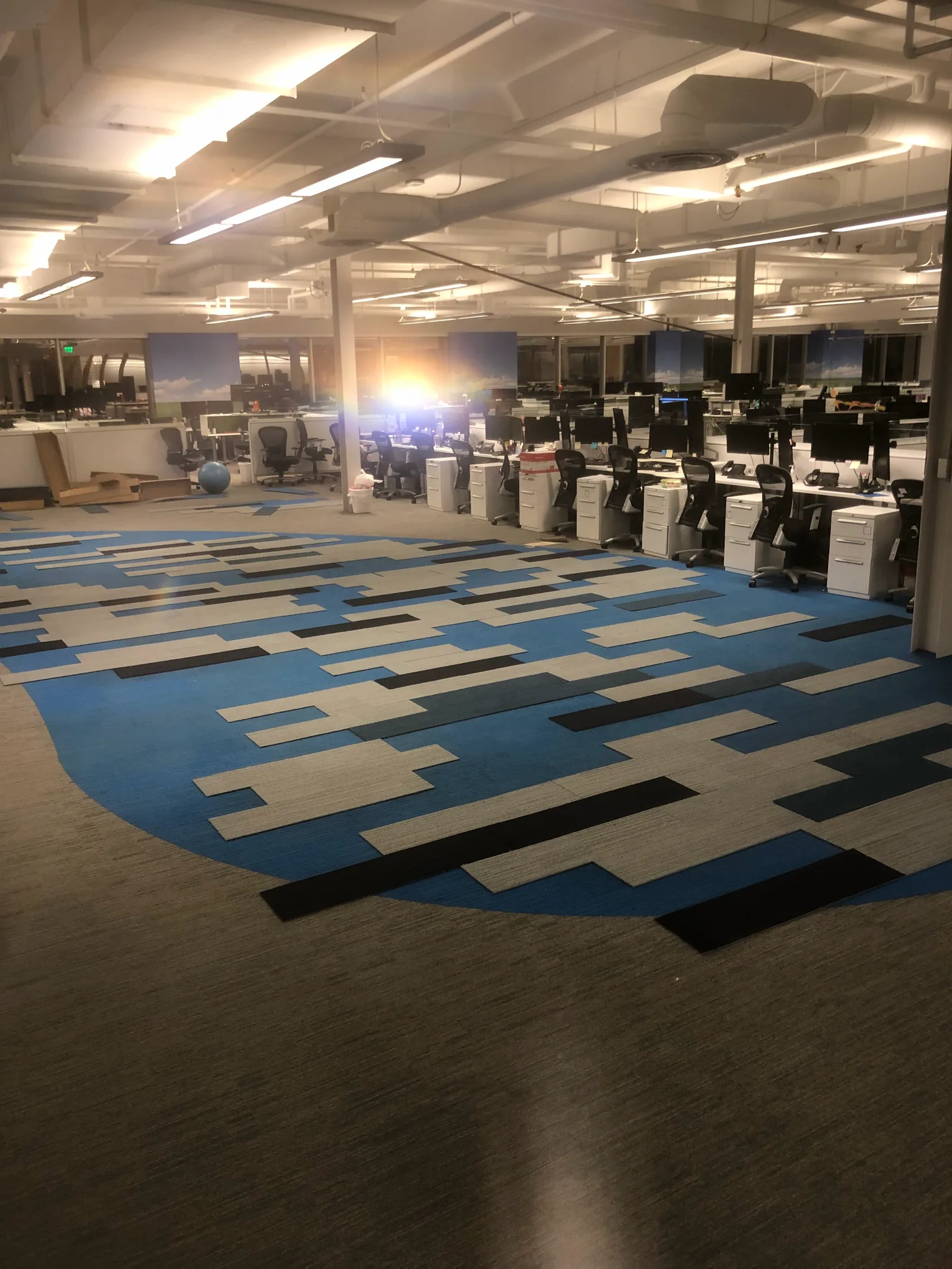 Blue, gray and charcoal carpet-tile field across an open office at the Wedgewood building in Redondo Beach, installed by Cal Coast Flooring