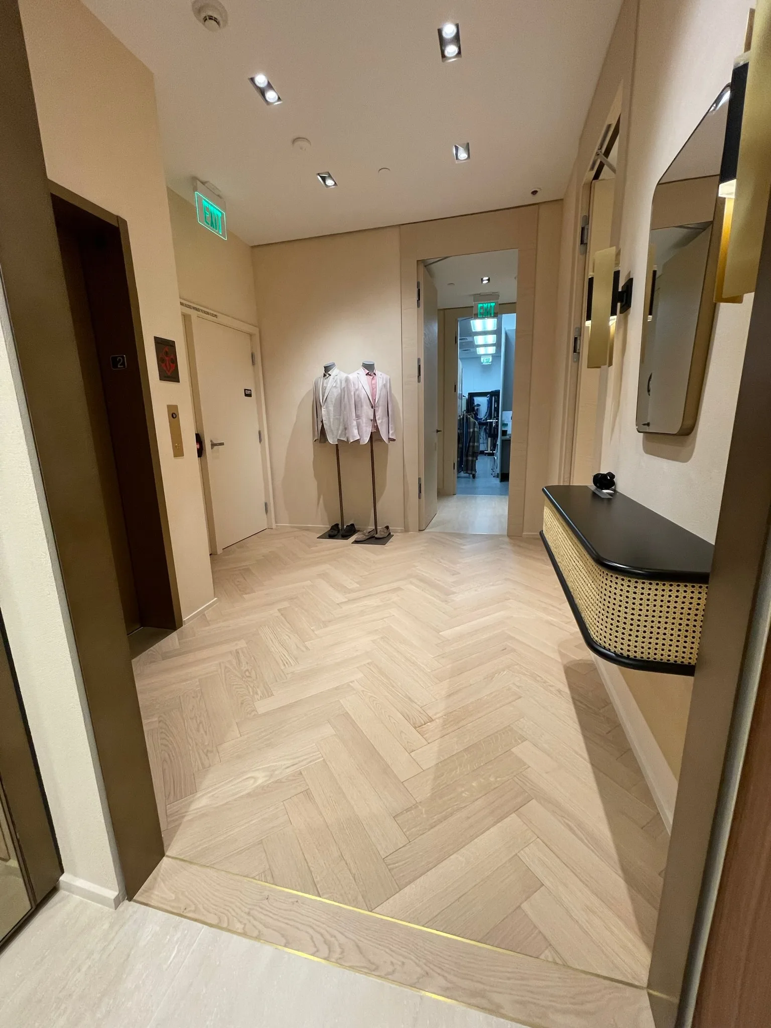 Oak herringbone flooring in the elevator lobby of the Zegna Beverly Hills store