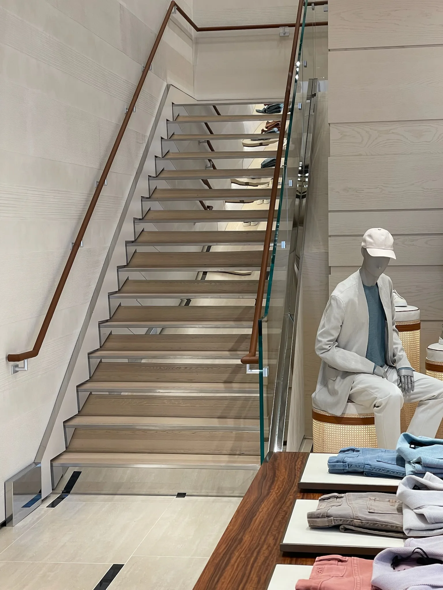 Prefinished oak stair treads and leather handrail beside the salesfloor at Zegna Beverly Hills