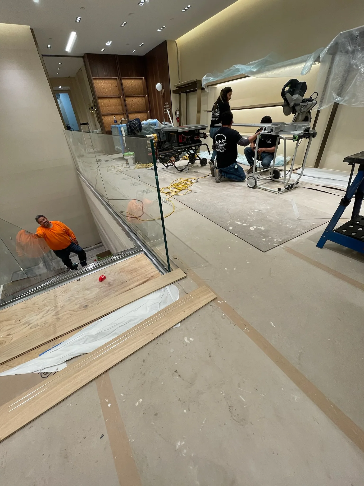 Cal Coast Flooring installers cutting flooring on-site during the Zegna Beverly Hills build-out